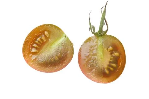 Two ripe cherry tomatoes sliced open Stock Photos