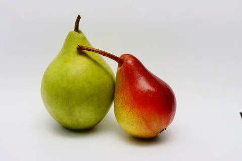 Two ripe pears on a white background. Stock Photos