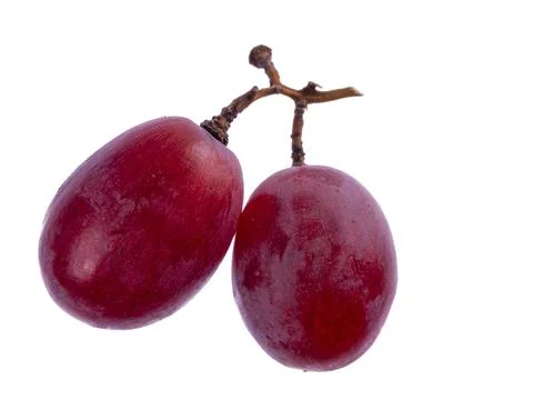 Two ripe red grapes on a small stem isolated on pure white background Foto stock