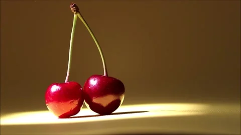 Two ripe sweet cherries with sunlight close-up. Stock Footage 164870210