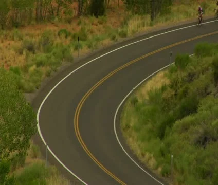 Two Road Bikes ride through Capitol Reef National Park Stock Footage 21646398