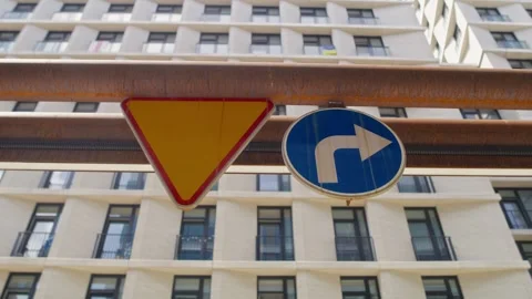 Two road signs on the building Video stock 248608558