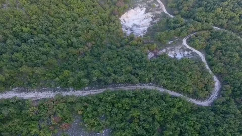 The two roads merge into the Woods Stock Footage 75677339