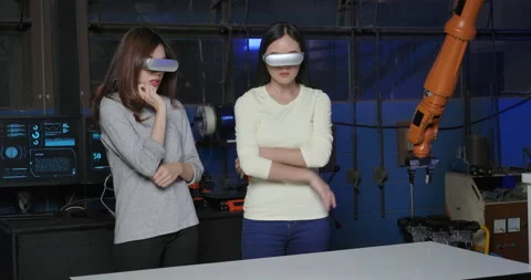 Two Robotics Engineer With VR Goggles Viewing the Project in 3D.  Video stock 153060961