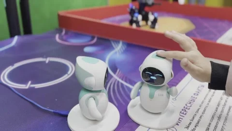 Two robots are playing a game on a table Stock Footage 283484742