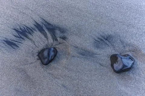 Two rocks in the sand. Stock Photos