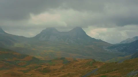 Two rocky peaks covered with clouds Video stock 167687295