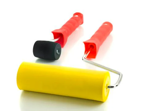 Two rollers for renovation on white Foto stock