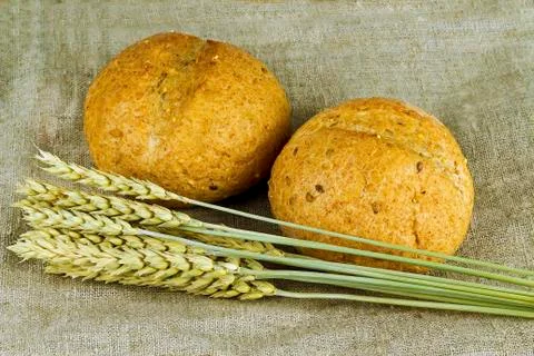 Two rolls and wheat Foto stock