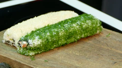 Two rolls of sushi rolls are added sushi roll in black sturgeon caviarм Stock Footage 88434498