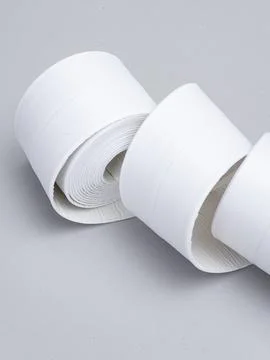 Two rolls of white edge trim tape Stock Photos