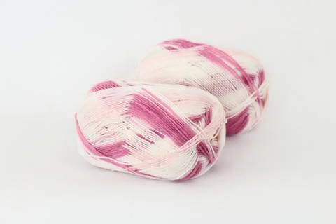 Two rolls of yarn on a white background. Stock-Fotos