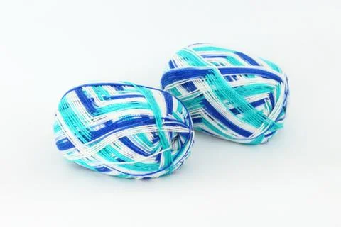 Two rolls of yarn on a white background. Stock Photos