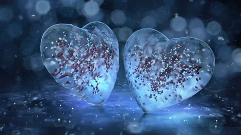 Two Rotating blue Ice Glass Hearts with red balls motion background Loop 4k Stock Footage 82214391