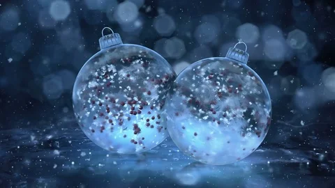 Two Rotating Christmas Blue Ice Glass Baubles snow red balls background loop Stock Footage 82436160