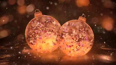 Two Rotating Christmas Gold Ice Baubles snow colorful petals background loop Stock Footage 82437710