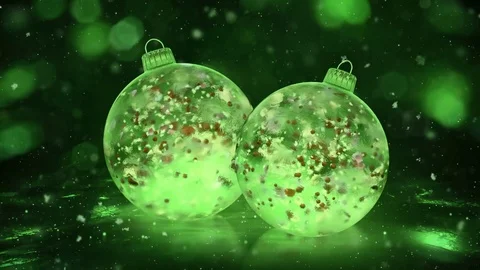 Two Rotating Christmas Green Ice Baubles snow colorful petals background loop Stock Footage 82430778
