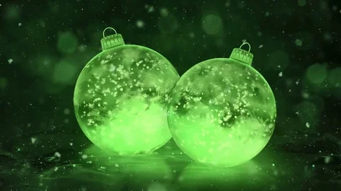 Two Rotating Christmas Green Ice Glass Baubles Decorations snow background loop Stock Footage 82430802