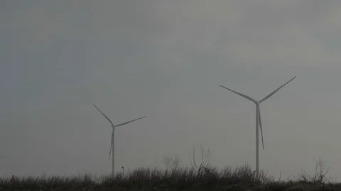 Two Rotating Wind Generators Against The Gray Sky. The Strength Of The Wind. Stock Footage 123712646