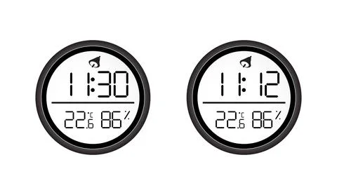 Two round black digital clocks with white screen showing time temperature and Stock Illustration