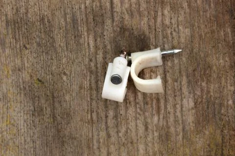 Two Round cable clips, nail, clamps, on white background Stock Photos