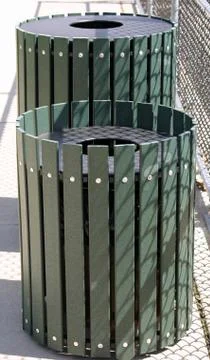 Two round trash cans in a sunny park Stock Photos