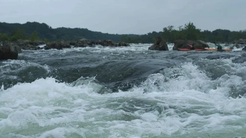 Two rowers approach rapids on the Potomac River Stock Footage 91911656