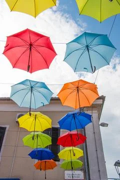 Two rows of colourful umbrellas on the sky Stock Photos