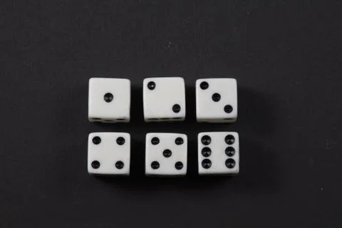 Two rows of dice showing numbers one to six Stock Photos