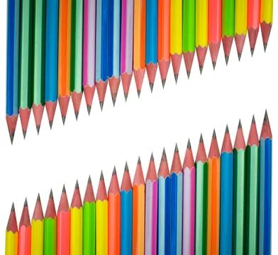 Two rows of different colored wood pencil crayons facing each other on white Foto stock