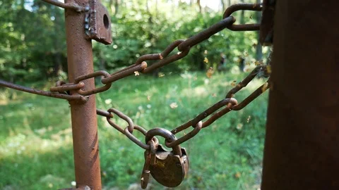 Two runners on the background, a chain with a padlock on the front Video stock 93846346