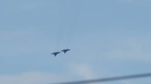 Two Russian fighter plane painted blue and red flies in the sky Stock Footage 236265439