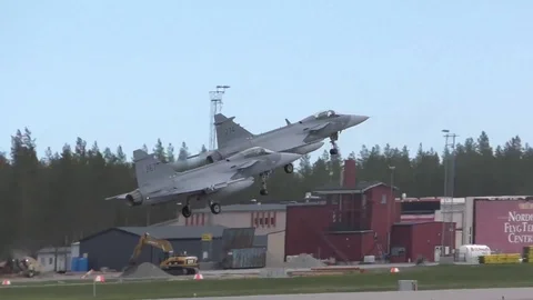 Two Saab JAS 39 Gripen take off in tandem during Arctic Challenge Exercise Stock Footage 109100346