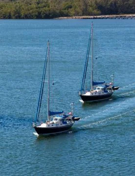 Two sail boats navigating Stock Photos