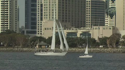 Two Sailboats; One small, One Large In The Marina Video stock 19258224