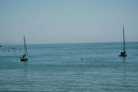 Two sailboats with space in between 스톡 사진