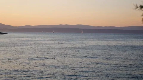 Two sailing boats going in sunset Stock Footage 112824139