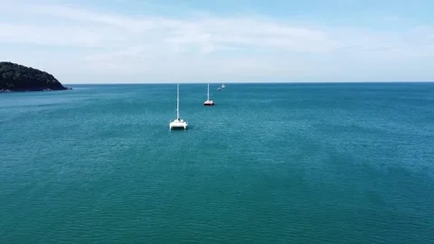Two sailing catamarans on the mooring Stock Footage 146303052