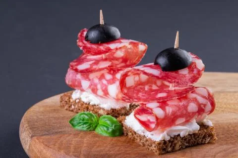 Two salami canapes Stock Photos