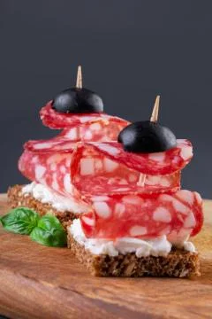 Two salami canapes Stock Photos