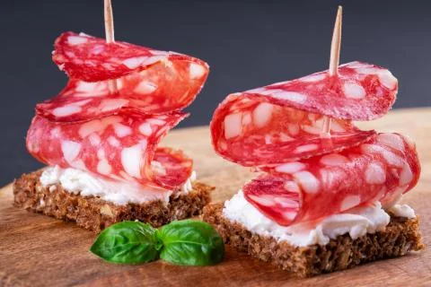 Two salami canapes Stock Photos