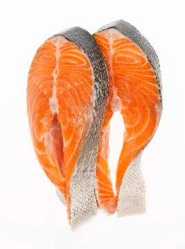 Two Salmon Steaks on a White Background Stock Photos