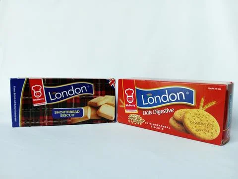 Two same brand boxes of London biscuits on white background. Stock Photos