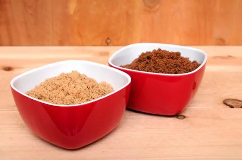 Two samples of brown and dark brown sugar Stock Photos