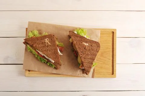 Two sandwiches from triangular pieces of bread with chicken breast Foto stock