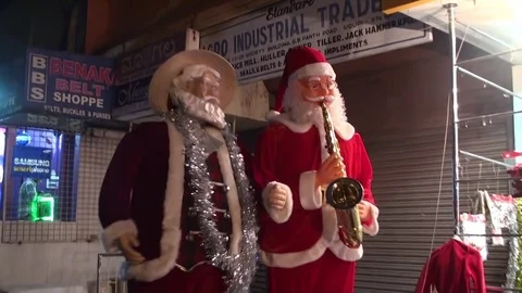 Two Santa Claus celebrating the beginning of Christmas Stock Footage 70169358