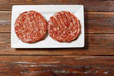 Two sausages is on the white table. Stock Photos