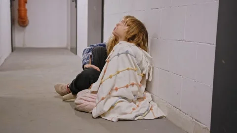 Two Scared Cowering Young Children Girls Hiding in Basement Shelter Stock Footage 254813357