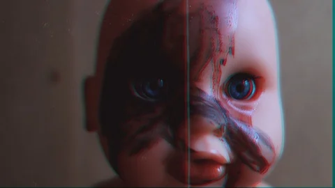 Two scary dolls are looking at the camera. VHS video. Stock Footage 123274256