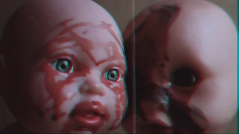 Two scary dolls are looking at the camera. VHS video. Video stock 123414036